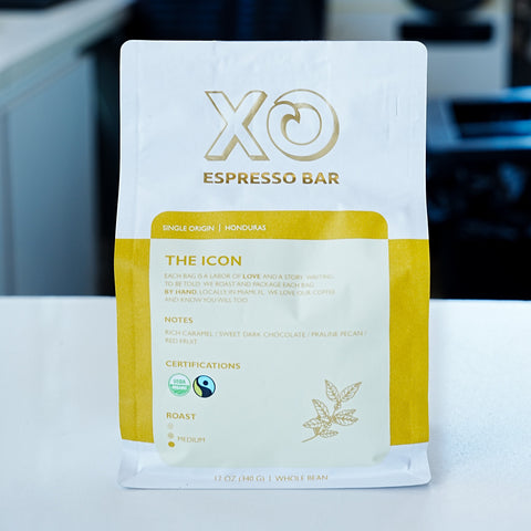 The complete XO The ICON retail coffee bag standing on the XO cafe counter
